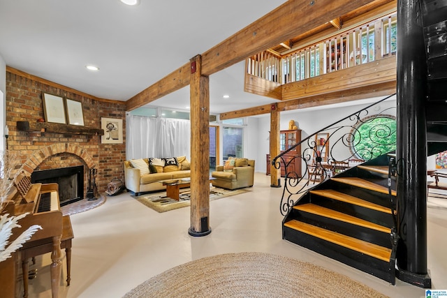 323 Taylor Rd, Remlap, AL 35133 - living room featuring finished concrete floors, a fireplace, stairway, and recessed lighting