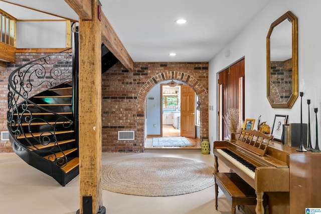 323 Taylor Rd, Remlap, AL 35133 - foyer entrance featuring brick wall, arched walkways, concrete flooring, and recessed lighting