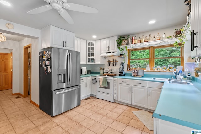 323 Taylor Rd, Remlap, AL 35133 - kitchen with stainless steel refrigerator with ice dispenser, electric range, under cabinet range hood, light tile patterned floors, and white cabinetry