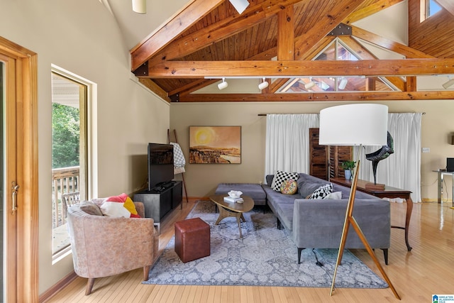 323 Taylor Rd, Remlap, AL 35133 - living room with wood finished floors, beam ceiling, high vaulted ceiling, and baseboards