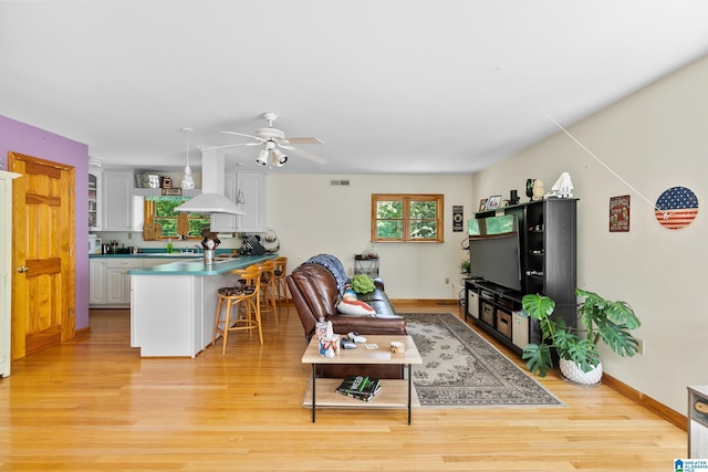 323 Taylor Rd, Remlap, AL 35133 - living area featuring a ceiling fan, light wood-style flooring, and baseboards