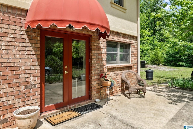 323 Taylor Rd, Remlap, AL 35133 - property entrance with french doors, brick siding, and a patio