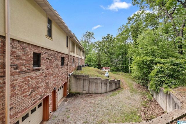 323 Taylor Rd, Remlap, AL 35133 - view of yard with cooling unit and a garage
