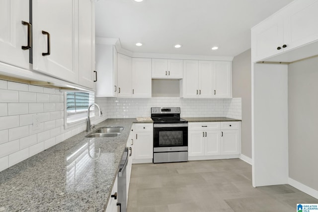 2636 20th Pl, Birmingham, AL 35208 - kitchen with a sink, appliances with stainless steel finishes, light stone countertops, and white cabinetry