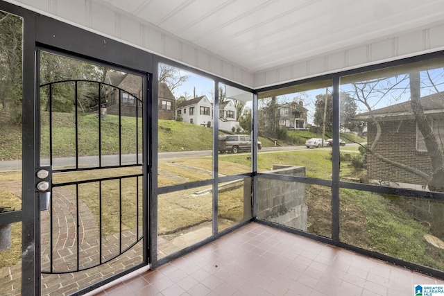 2636 20th Pl, Birmingham, AL 35208 - unfurnished sunroom featuring a residential view