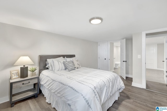 2636 20th Pl, Birmingham, AL 35208 - bedroom featuring baseboards and wood finished floors