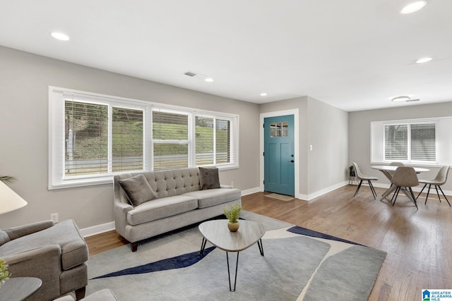 2636 20th Pl, Birmingham, AL 35208 - living area with baseboards, recessed lighting, wood finished floors, and visible vents
