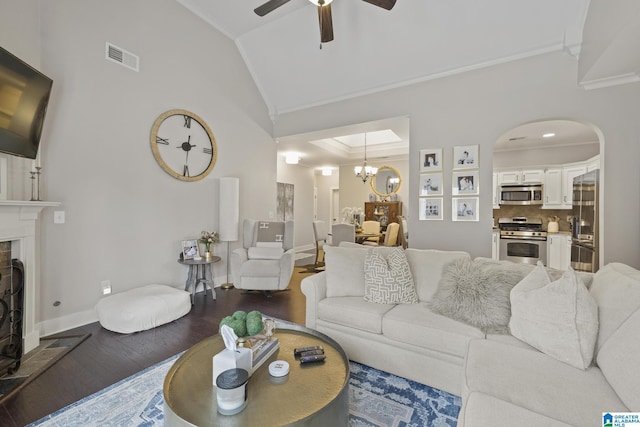 1204 Grants Way, Irondale, AL 35210 - living room with dark wood-style floors, ornamental molding, a ceiling fan, lofted ceiling, and a fireplace with raised hearth