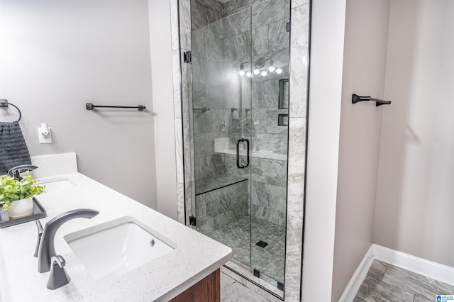 145 Cameron Ct, Alexandria, AL 36250 - bathroom with baseboards, a sink, and a stall shower