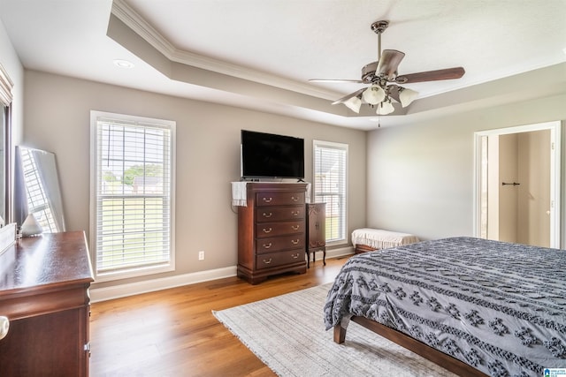 145 Cameron Ct, Alexandria, AL 36250 - bedroom with crown molding, baseboards, a tray ceiling, and wood finished floors