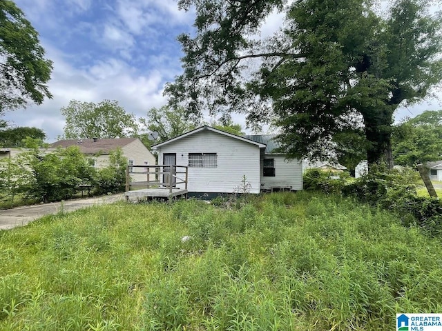 back of property featuring a deck
