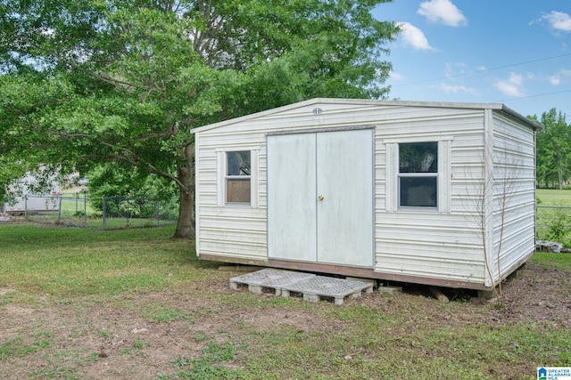 view of shed with fence