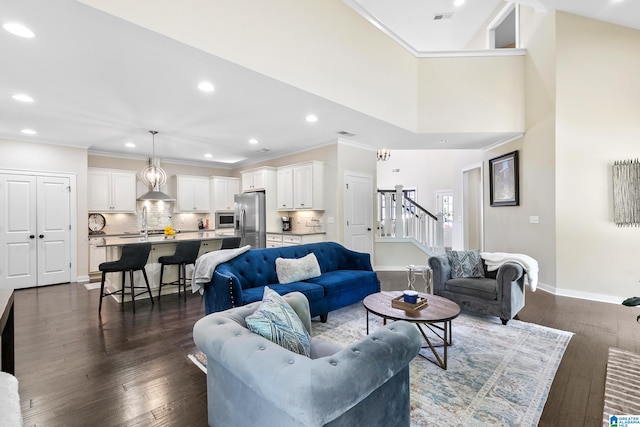 4000 Dunemere Ln, Hoover, AL 35226 - living room featuring stairway, dark wood-type flooring, recessed lighting, and crown molding