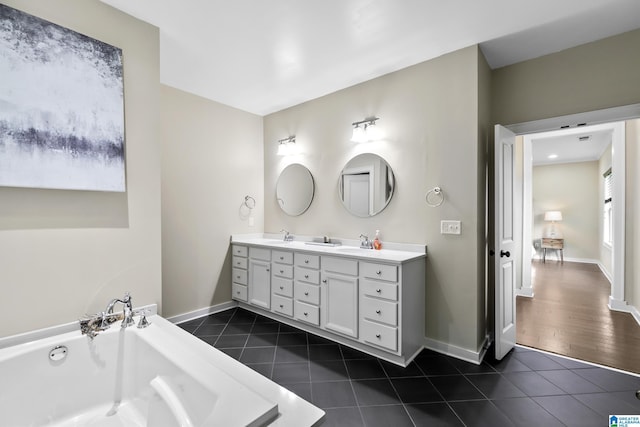 4000 Dunemere Ln, Hoover, AL 35226 - full bathroom with tile patterned floors, double vanity, and a tub to relax in