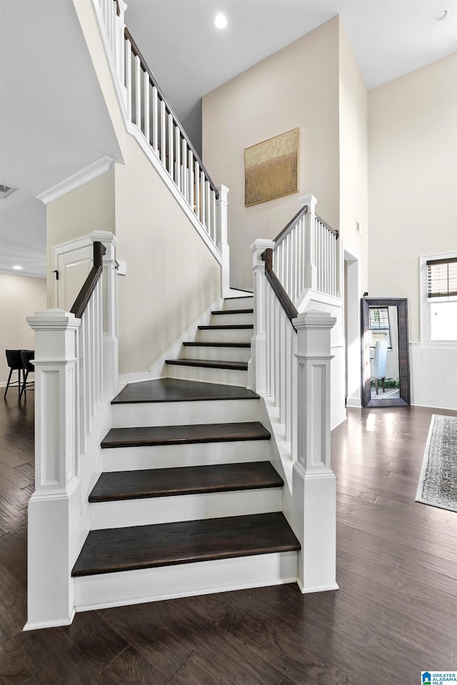 4000 Dunemere Ln, Hoover, AL 35226 - stairway featuring wood finished floors, recessed lighting, a high ceiling, and ornamental molding