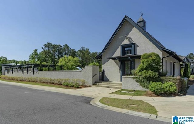 4000 Dunemere Ln, Hoover, AL 35226 - tudor-style house with stucco siding