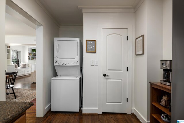1305 31st St S Unit 202, Birmingham, AL 35205 - laundry area with stacked washer and clothes dryer, crown molding, and dark wood-style flooring