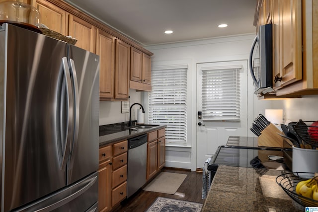 1305 31st St S Unit 202, Birmingham, AL 35205 - kitchen featuring stainless steel appliances, a sink, dark wood-type flooring, dark stone countertops, and brown cabinets