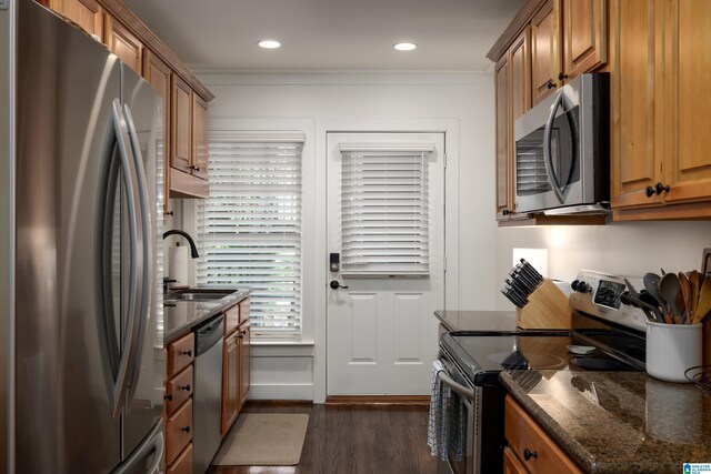 1305 31st St S Unit 202, Birmingham, AL 35205 - kitchen with appliances with stainless steel finishes, a sink, dark wood-style floors, brown cabinets, and dark stone countertops