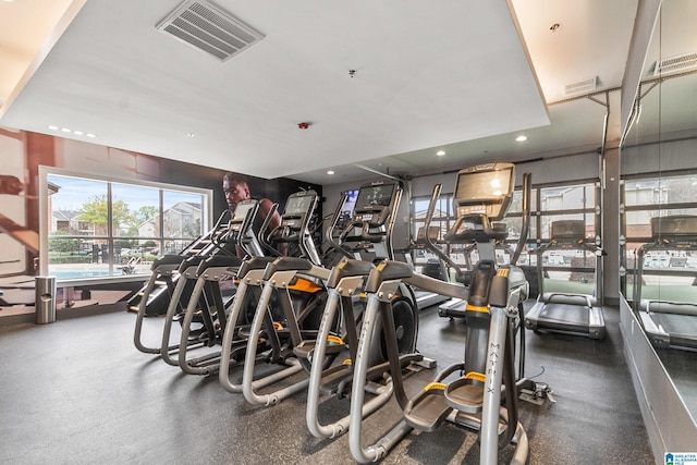gym featuring recessed lighting and visible vents