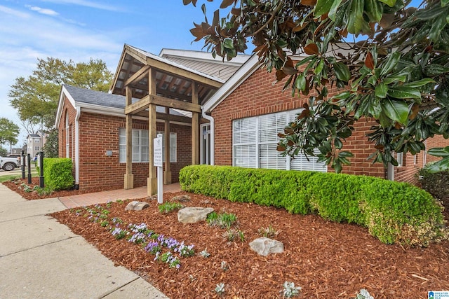 view of front of property featuring brick siding