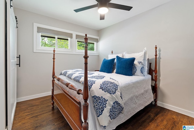 bedroom with a ceiling fan, baseboards, and wood finished floors