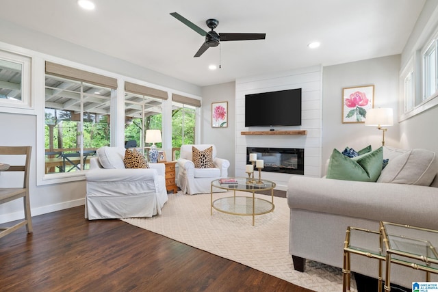 living room with recessed lighting, a ceiling fan, baseboards, and wood finished floors
