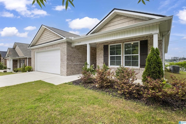 ranch-style home with a garage, driveway, a front lawn, and brick siding