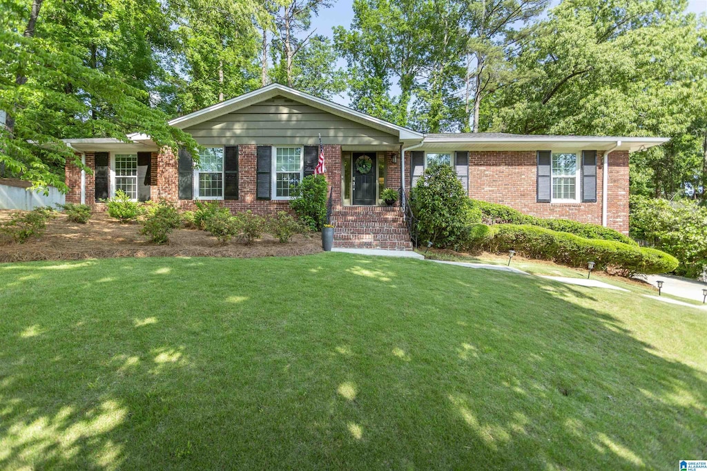 2617 Vestavia Forest Ter, Vestavia Hills, AL 35216 - ranch-style home featuring a front yard and brick siding