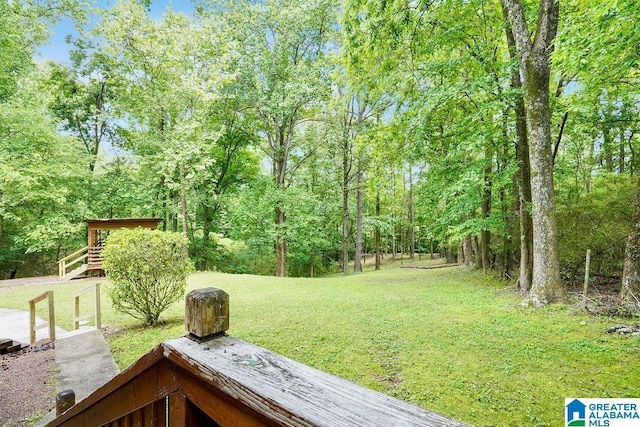 view of yard featuring a forest view