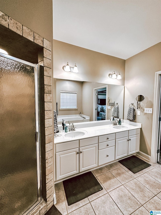 bathroom featuring tile patterned floors, a stall shower, double vanity, and a bath