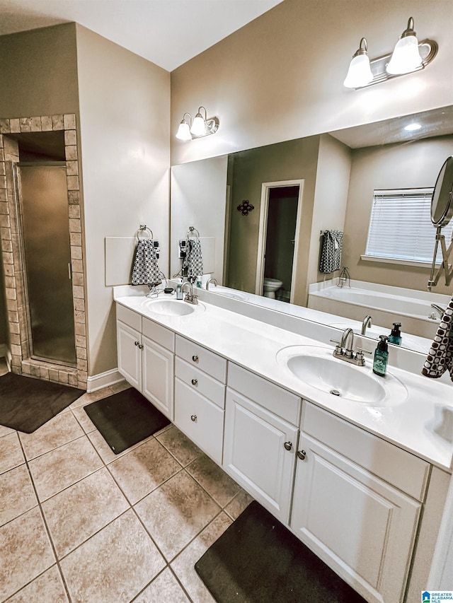 full bath with a shower stall, toilet, tile patterned floors, double vanity, and a bath