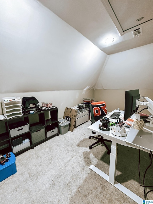 home office featuring lofted ceiling and carpet floors