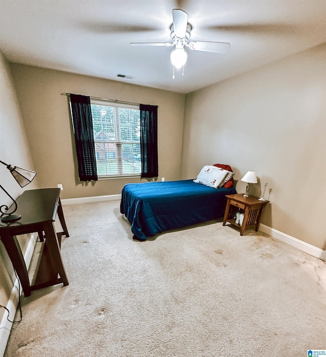 bedroom with carpet flooring, baseboards, and a ceiling fan