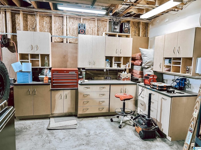 kitchen featuring concrete flooring and open shelves