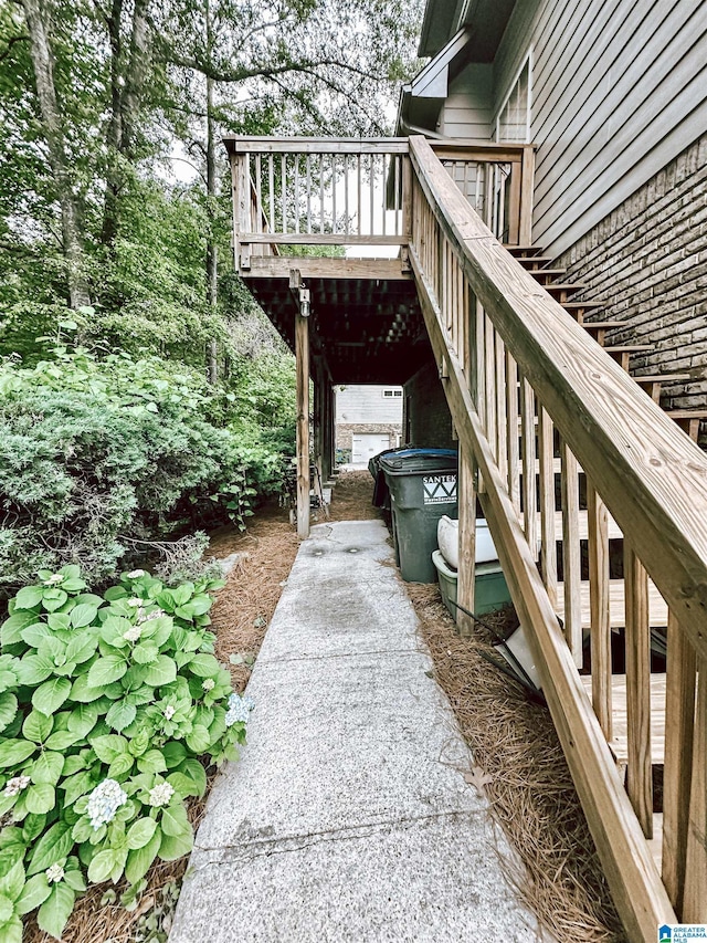 view of yard featuring stairs and a wooden deck