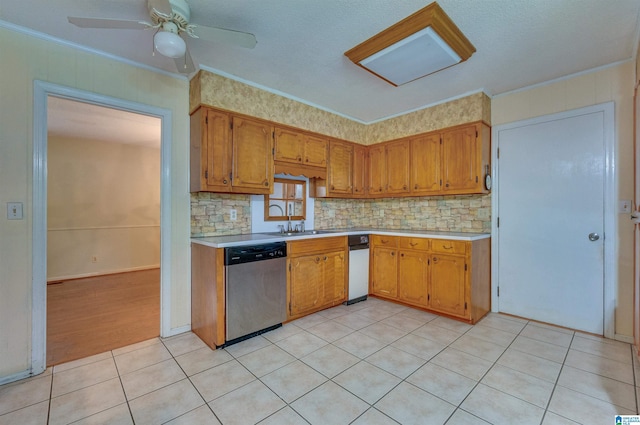 105 Campbell Rd, Clanton, AL 35045 - kitchen with stainless steel dishwasher, crown molding, light countertops, and brown cabinets
