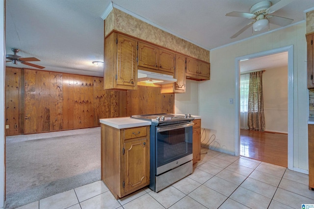 105 Campbell Rd, Clanton, AL 35045 - kitchen with under cabinet range hood, stainless steel electric range oven, light tile patterned floors, and ceiling fan