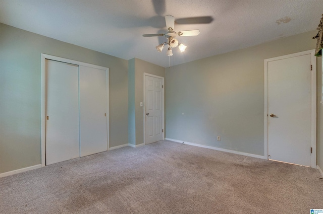 105 Campbell Rd, Clanton, AL 35045 - unfurnished bedroom featuring a closet, light carpet, baseboards, and ceiling fan