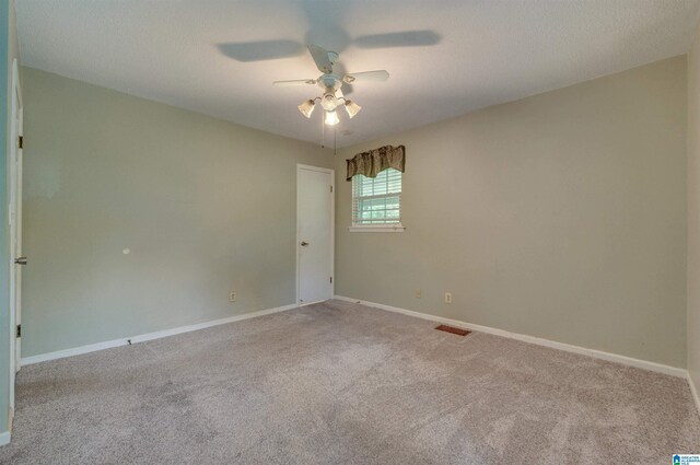 105 Campbell Rd, Clanton, AL 35045 - empty room with carpet floors, a ceiling fan, baseboards, and visible vents