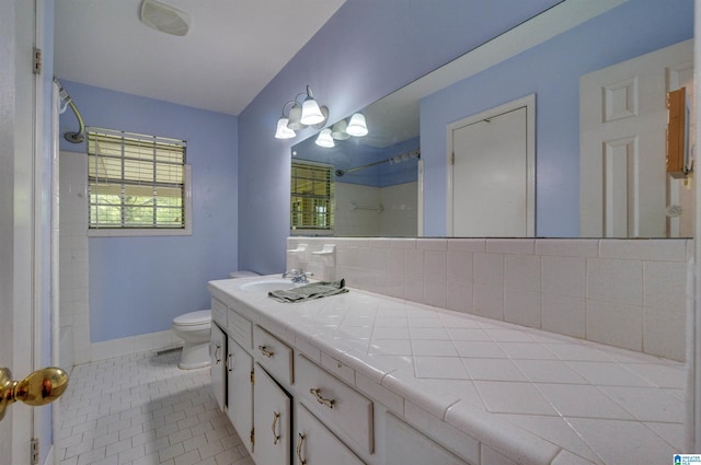 105 Campbell Rd, Clanton, AL 35045 - full bath featuring toilet, a shower, vanity, tile patterned flooring, and backsplash