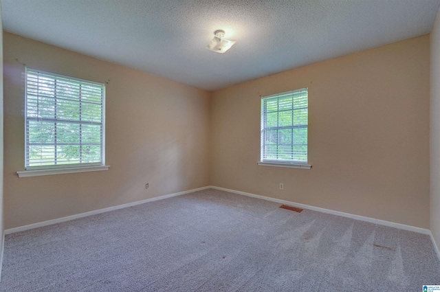 105 Campbell Rd, Clanton, AL 35045 - carpeted spare room with a textured ceiling, visible vents, and baseboards