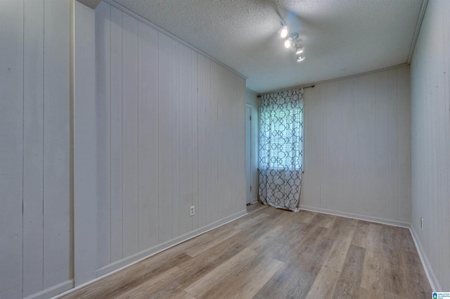 105 Campbell Rd, Clanton, AL 35045 - spare room featuring baseboards, a textured ceiling, and wood finished floors