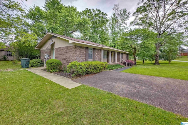 105 Campbell Rd, Clanton, AL 35045 - view of home's exterior with a yard and brick siding