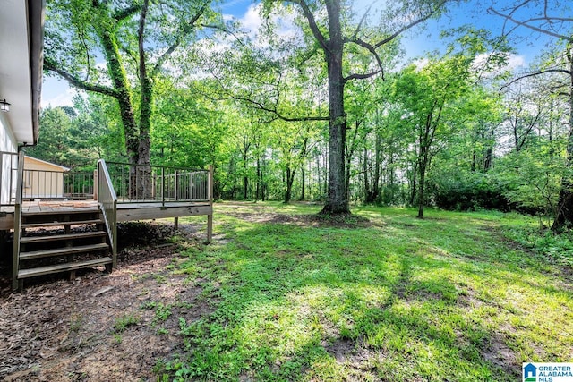 view of yard featuring a wooden deck