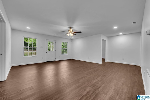 unfurnished living room with recessed lighting, baseboards, ceiling fan, and dark wood-style flooring
