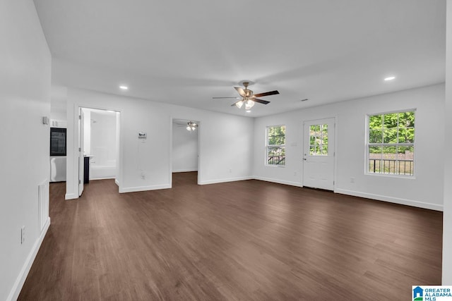 unfurnished living room with recessed lighting, baseboards, dark wood finished floors, and ceiling fan