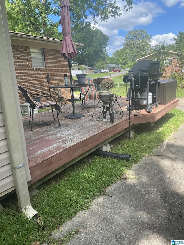 wooden deck with outdoor dining area