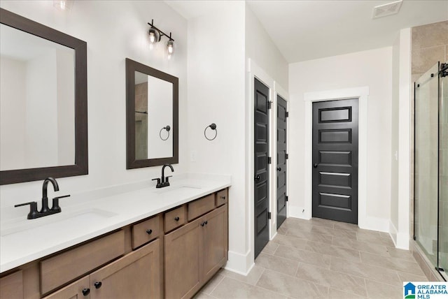 4546 Brexton St, Trussville, AL 35173 - bathroom with visible vents, a sink, and a stall shower