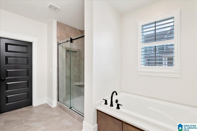 4546 Brexton St, Trussville, AL 35173 - full bath featuring tile patterned flooring, visible vents, a shower stall, and a garden tub